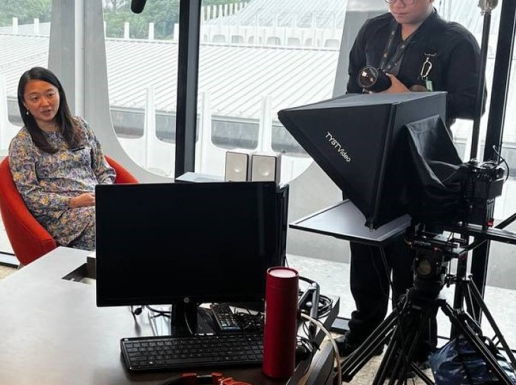 Monitor Teleprompter system in a modern office setting.
