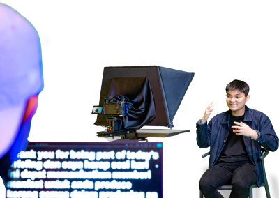 Presenter reading from a 22” Monitor Teleprompter screen